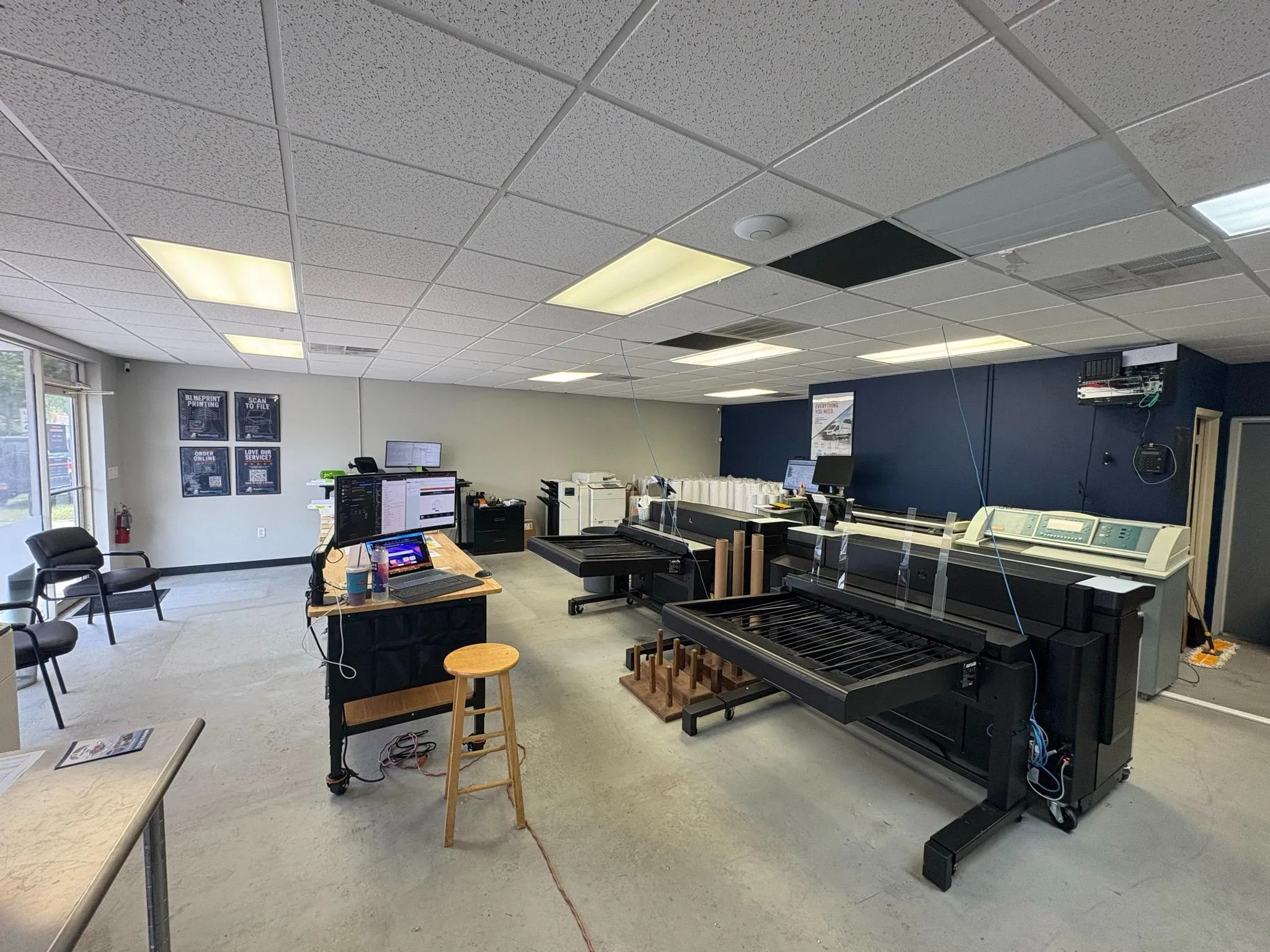 Rapid Blueprint shop interior showing large-format printing equipment